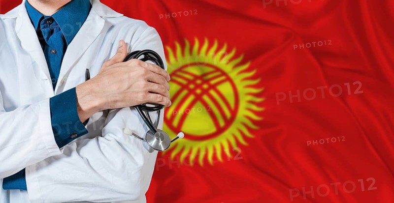 Doctor with stethoscope on Kyrgyzstan flag. Doctor holding stethoscope on Kyrgyzstan flag