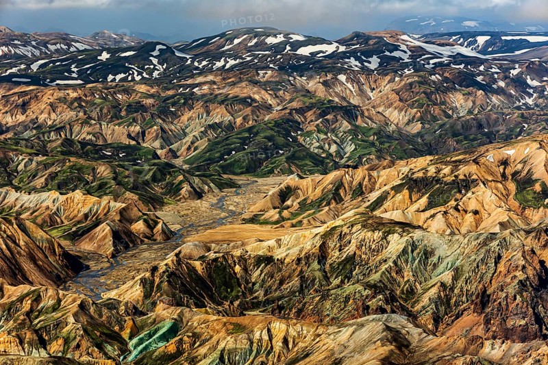 Mountain landscape, snowfields, sunny, summer, volcanic landscape, aerial view, ryolite rock (green), Landmannalaugar, Fjallabak Nature Reserve, Icelandic Highlands, Iceland
