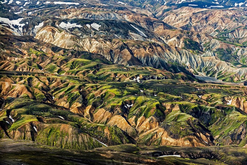 Mountain landscape, snowfields, sunny, summer, volcanic landscape, aerial view, Landmannalaugar, Fjallabak Nature Reserve, Icelandic Highlands, Iceland
