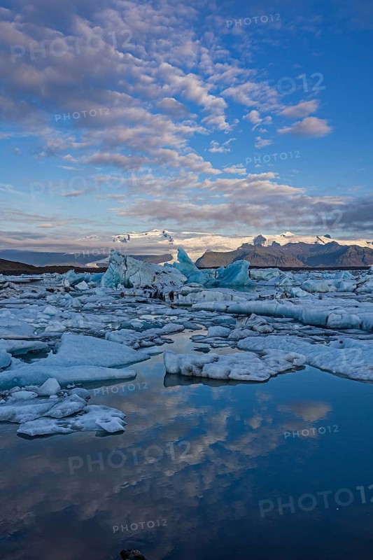 Icebergs, ice floes, lake, glacier lagoon, glacier, mountains, clouds, summer, morning mood, reflection, Jökulsarlon, Vatnajökull National Park, Iceland