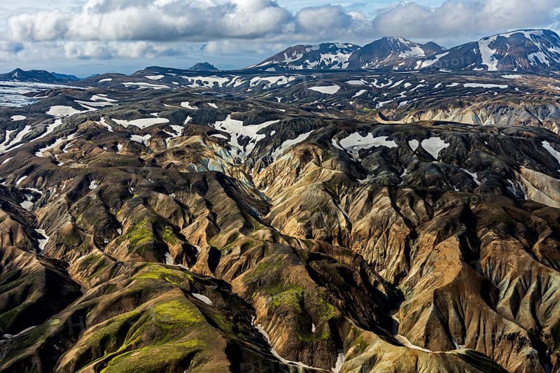 Mountain landscape, sunny, summer, snowfields, volcanic landscape, aerial view, Landmannalaugar, Fjallabak Nature Reserve, Icelandic Highlands, Iceland
