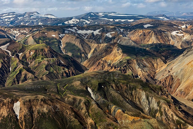 Mountain landscape, sunny, summer, snowfields, volcanic landscape, aerial view, Landmannalaugar, Fjallabak Nature Reserve, Icelandic Highlands, Iceland