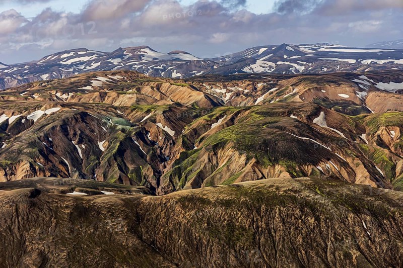 Mountain landscape, sunny, summer, snowfields, volcanic landscape, aerial view, Landmannalaugar, Fjallabak Nature Reserve, Icelandic Highlands, Iceland