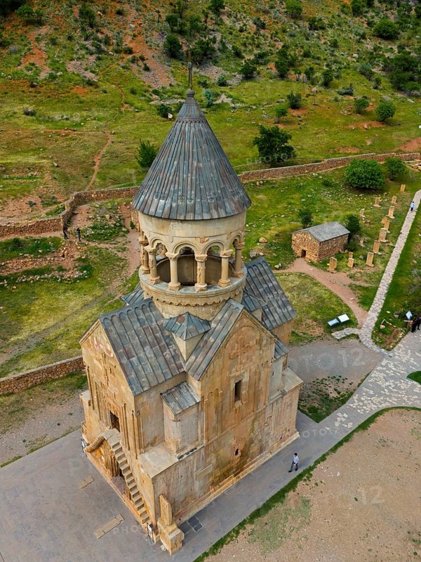 Old stone church with tower in mountainous landscape and green areas, aerial view, Noravank monastery, mausoleum church Surb Astvatsatsin, Noravank, Vayots Dzor province, Vayots Dzor, Armenia, Caucasus