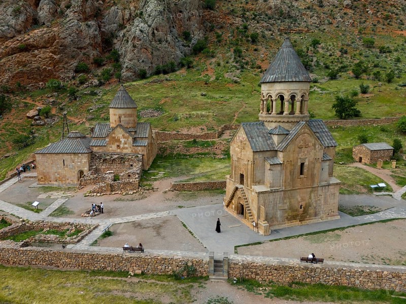 Old church in rural area with stone buildings and green landscape surrounded by mountains, aerial view, Noravank monastery, on the right mausoleum church Surb Astvatsatsin and on the left Baptist church Surb Karapet, Noravank, Vayots Dzor province, Vayots Dzor, Armenia, Caucasus