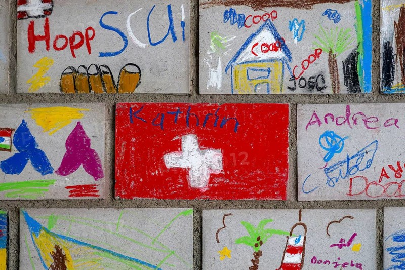 Brick wall painted by schoolchildren, Interlaken, Switzerland