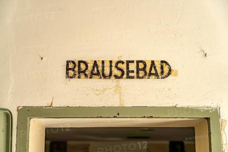 Shower bath inscription on a gas chamber, Dachau Concentration Camp Memorial, Bavaria, Germany