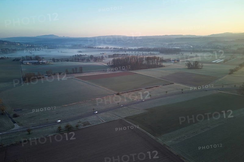 Agricultural fields and meadows in the early morning fog, Reuss Valley, Merenschwand, Freiamt, Canton, Aargau, Switzerland