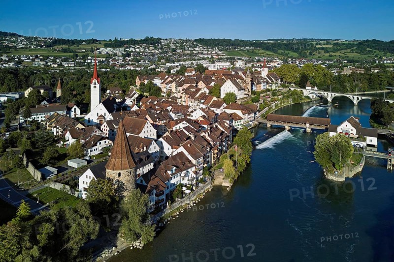 Old town with the Catholic Church of St. Nicholas, the tower of the Muri- Amthof and the witches' tower, on the right the museum Reusskraftwerk Bruggmühle and the old wooden bridge over the river Reuss, Bremgarten, Freiamt, Canton, Aargau, Switzerland