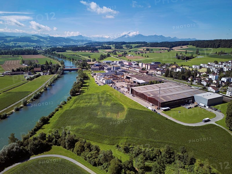 River Reuss, on the right the industrial area, behind the old wooden bridge and the Pilatus, Sins, Freiamt, Canton, Aargau, Switzerland