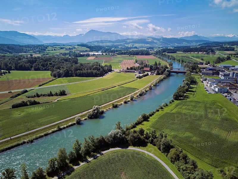 River Reuss, on the right the industrial area, behind the old wooden bridge and the Pilatus, Sins, Freiamt, Canton, Aargau, Switzerland