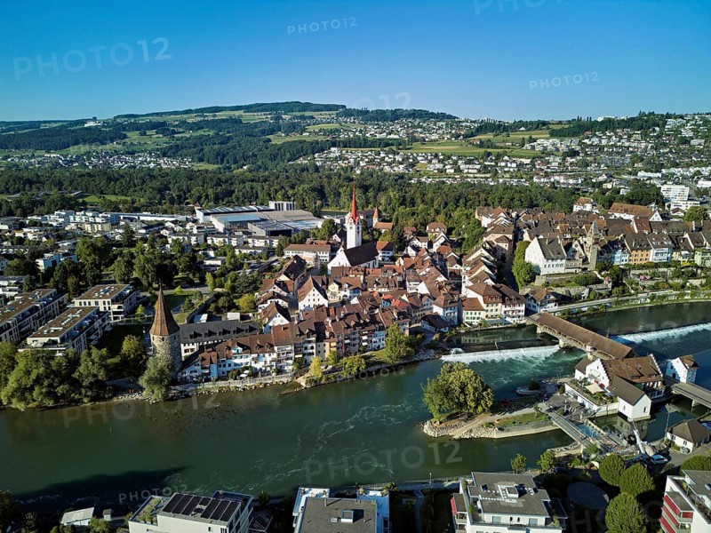 Old town with the Catholic Church of St Nicholas and the Witches' Tower, in the foreground the Museum Reusskraftwerk Bruggmühle and the old wooden bridge over the river Reuss, Bremgarten, Freiamt, Canton, Aargau, Switzerland