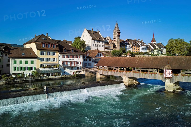 Old town with the tower of the Muri- Amthof, in the foreground the weir and the old wooden bridge over the river Reuss, Bremgarten, Freiamt, Canton, Aargau, Switzerland