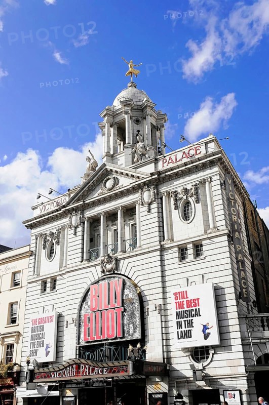 London, England, Great Britain, Europe, Classic theatre building with eye-catching lettering and decorations under a blue sky