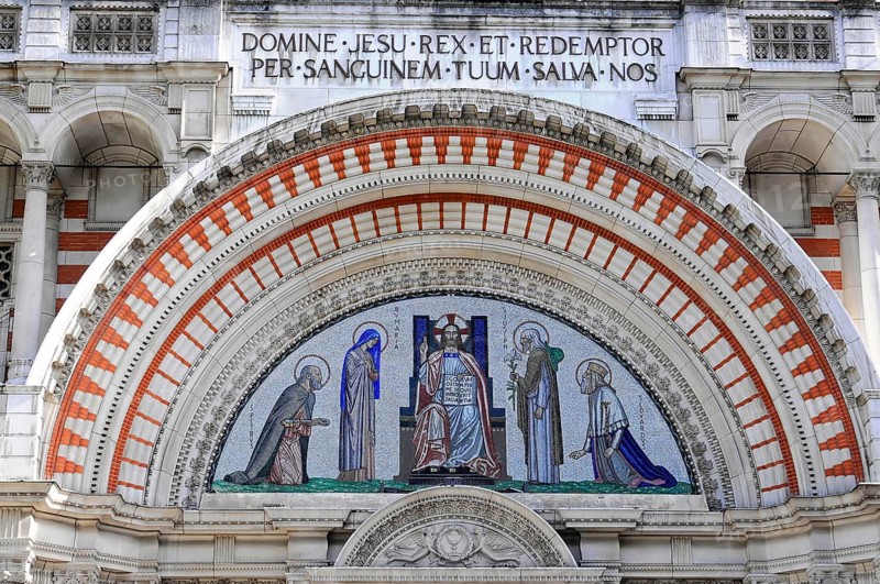 Partial view of Westminster Cathedral, London, England, Great Britain, Europe, Detailed mosaic with religious symbols and depiction of Christ under a decorative arch, London region