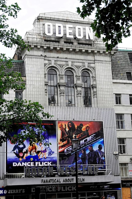 London, England, Great Britain, Europe, Odeon cinema with eye-catching advertising and posters, prestigious architecture
