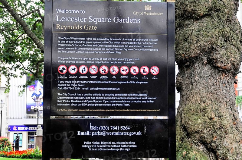 Information sign with park rules and prohibitions in Leicester Square Gardens, Westminster, London, England, United Kingdom