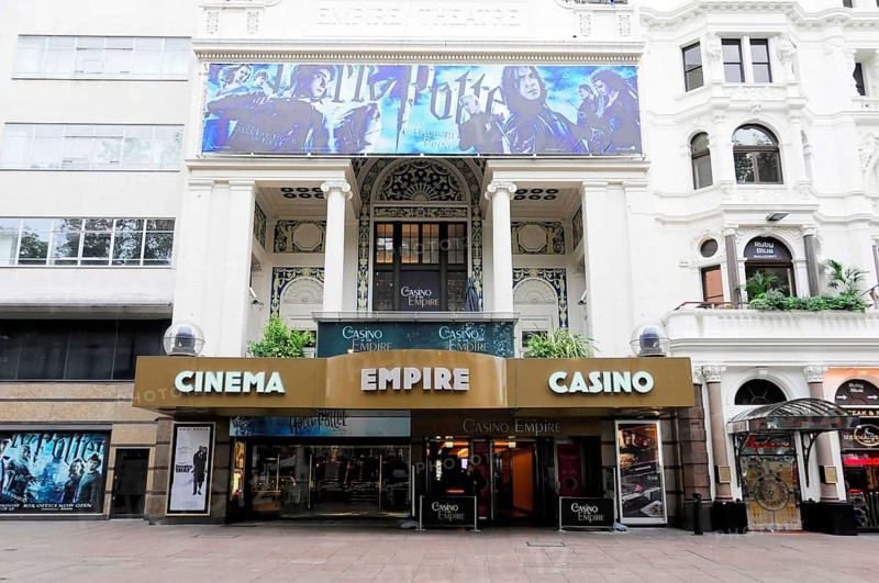 London, England, Great Britain, Europe, Exterior view of a cinema with casino in London, decorative facade with film posters