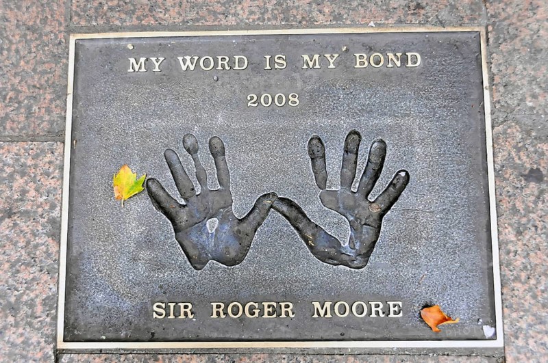 Plaque with handprints and the inscription by Sir Roger Moore, My Word Is My Bond 2008, London, England, Great Britain