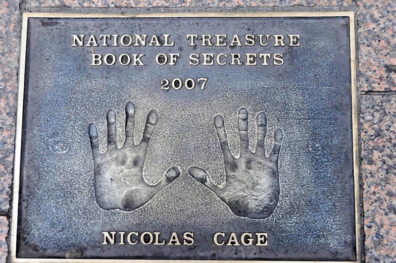 Nicolas Cage's handprints for National Treasure on a metal plate on the pavement, London, England, Great Britain