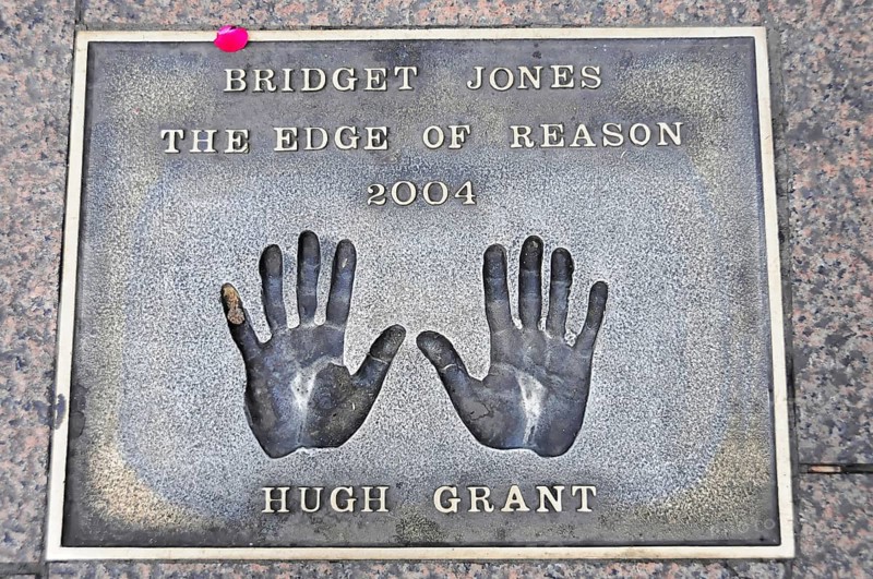 Handprints of Hugh Grant for the film Bridget Jones on a metal plate on the pavement, London, England, Great Britain