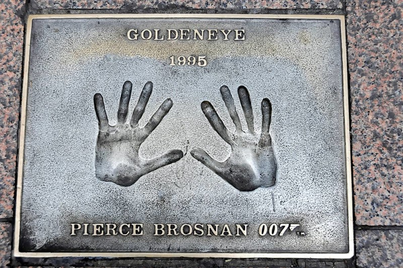 Handprints of Pierce Brosnan for the film GoldenEye on a metal plate on the pavement, London, England, Great Britain