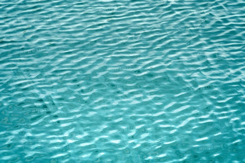 Full frame abstract light blue ripply water surface