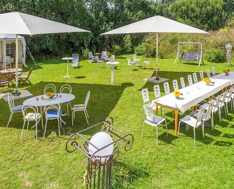 Sunny illuminated idyllic scenery showing a garden prepared for party