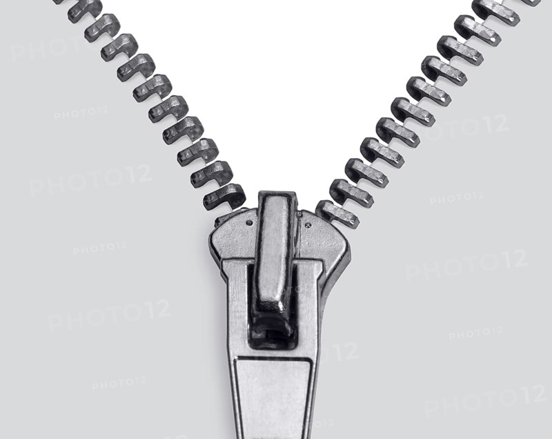 Studio photography showing the detail of a zipper in light back