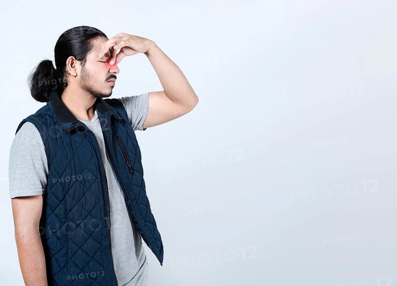 Sore man with sinus pain on isolated