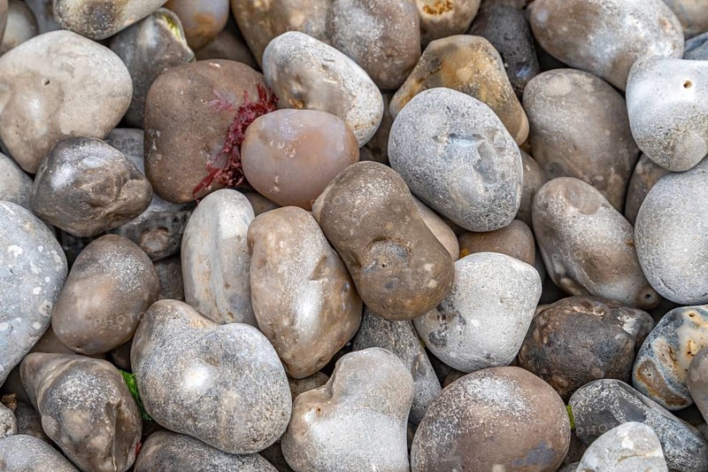 Full frame picture showing lots of cobbles seen at the Normandy region in France