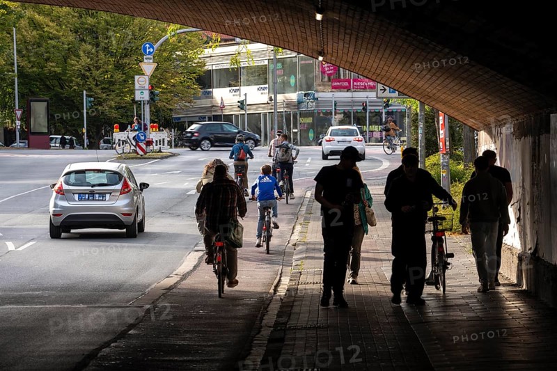 Cycle traffic in Münster, cycle path on Wolbecker Straße, tunnel under the tracks at the main railway station, cycle path red asphalt, marked, city centre of Münster, dense cycle traffic, North Rhine-Westphalia, Germany