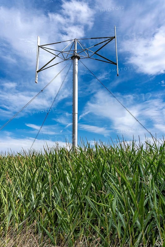 Vertical axis wind turbine, Darrieu wind turbine, 2 vertically mounted rotors rotate around the axis, near Darup in Münsterland, North Rhine-Westphalia, Germany