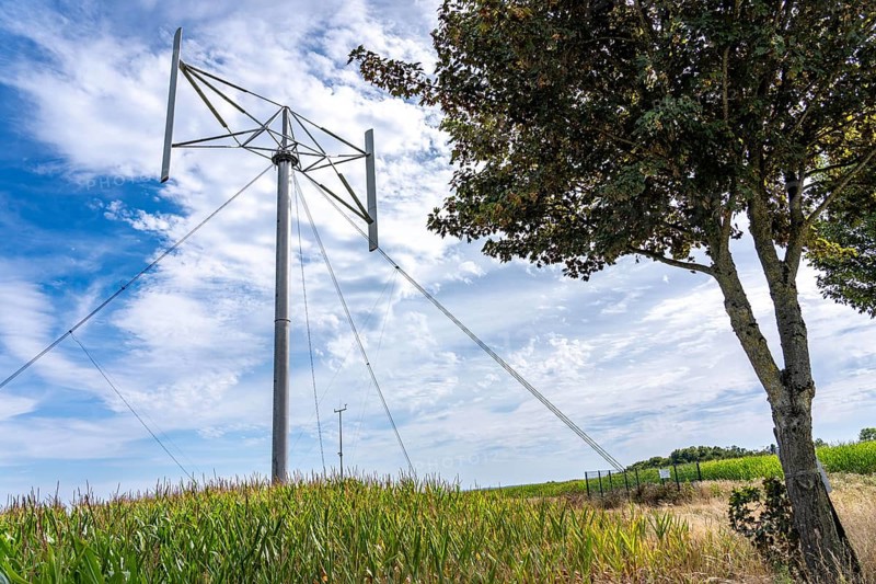 Vertical axis wind turbine, Darrieu wind turbine, 2 vertically mounted rotors rotate around the axis, near Darup in Münsterland, North Rhine-Westphalia, Germany