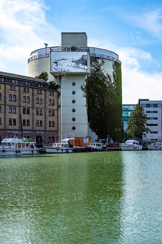 District heating storage in Münster, at the harbour, former coal bunker, 8 million litres of hot district heating water is stored in 4 water tanks, which is released into the district heating network to households as required, the district heating is generated in the neighbouring combined cycle power plant, natural gas power plant, Münster, North Rhine-Westphalia, Germany