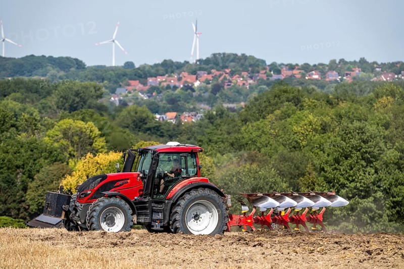 Tractor ploughs up a harvested grain field, south of Billerbeck in Münsterland, North Rhine-Westphalia, Germany