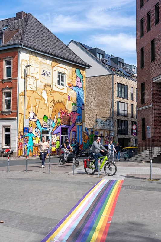 Münster harbour district, harbour square, colourfully painted houses, rainbow cycle path marking, North Rhine-Westphalia, Germany