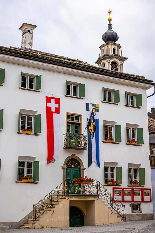 Beautiful City Hall with Swiss and Canton Flag in a Summer Day in Samedan, Grisons, Switzerland