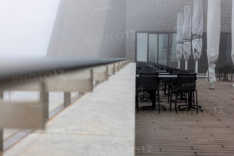 Modern Restaurant Terrace with Railing in the Clouds in a Cloudy Day in Monte Generoso, Ticino, Switzerland