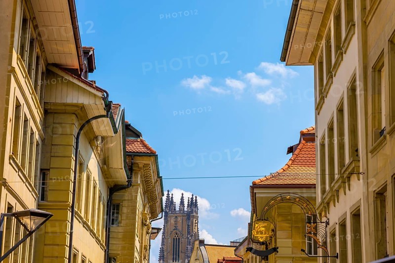 Cityscape with Cathedral Tower in a Sunny Summer Day in City of Fribourg, Canton Fribourg, Switzerland