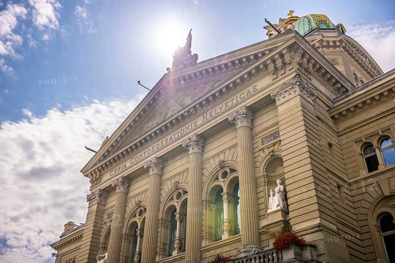 Beautiful Bundeshaus Parliament Building or Federal Palace in a Sunny Day with Sunlight and Lens Flare in City of Bern, Canton Bern, Switzerland