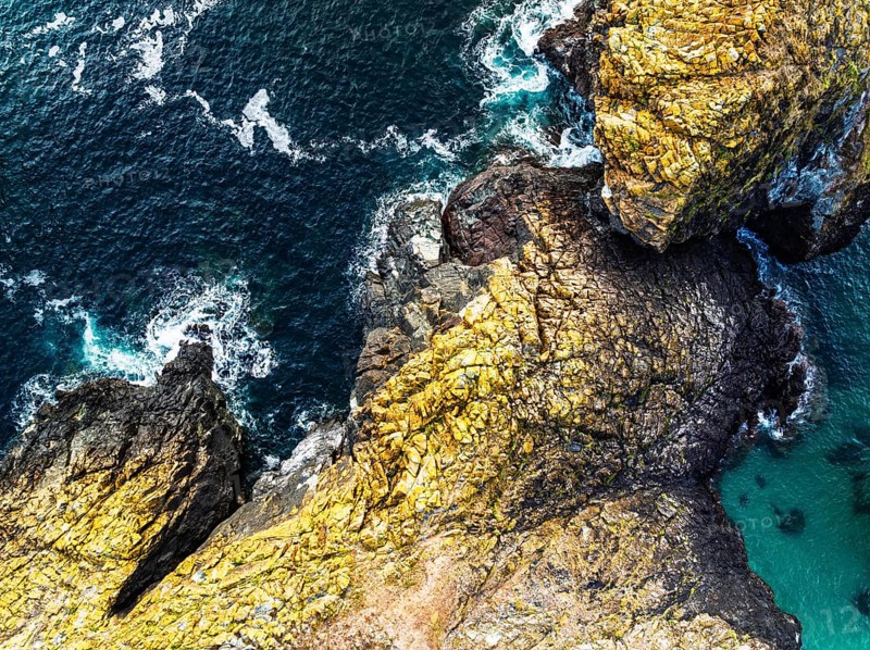 Top Down view over Kynance Cove from a drone, Mount's Bay, Lizard Point, Cornwall, England, United Kingdom