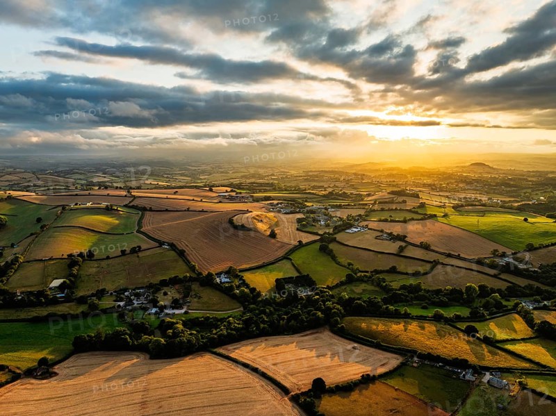 Sunset of Fields and Farms over Devon from a drone, Torquay, Torbay, Devon, England, United Kingdom