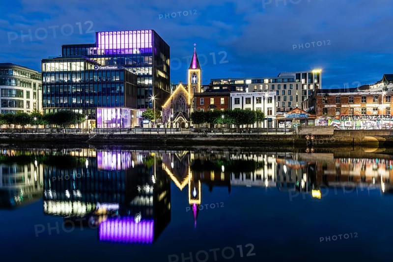 Office building and church reflected in the River Liffey, blue hour, Dublin, Ireland