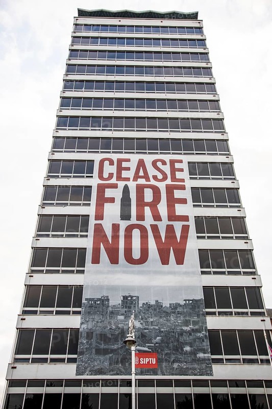 Appeal for peace and ceasefire, poster on a tower block, Dublin, Ireland