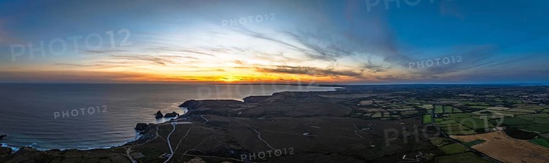 Sunset over Kynance Cove from a drone, Mount's Bay, Lizard Point, Cornwall, England, United Kingdom