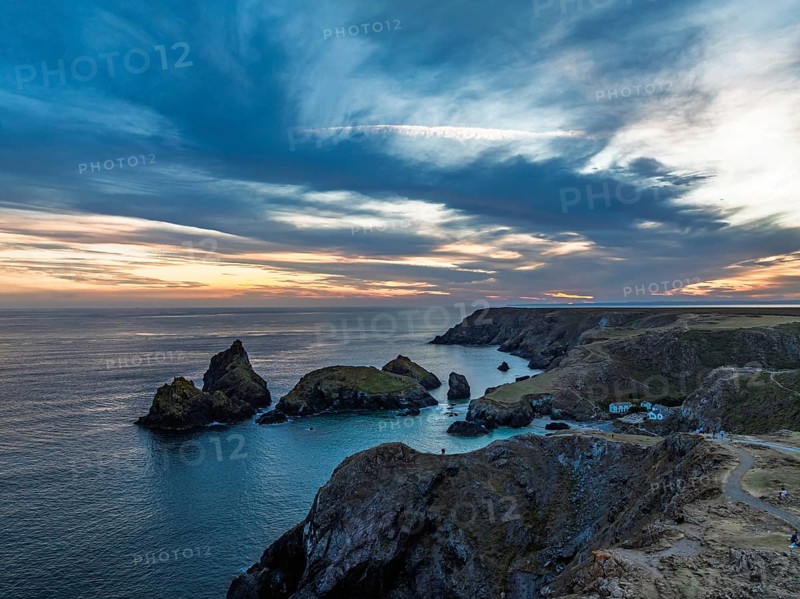 Sunset over Kynance Cove from a drone, Mount's Bay, Lizard Point, Cornwall, England, United Kingdom