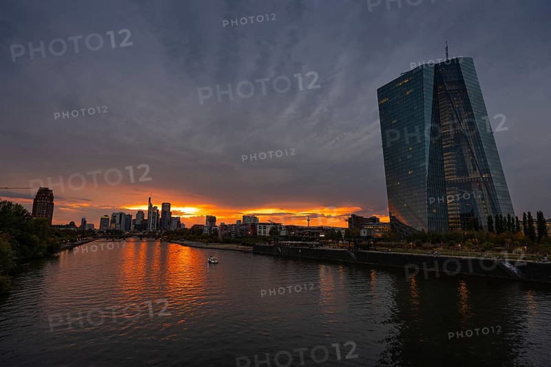 Clouds pass over the headquarters of the European Central Bank (ECB) in Frankfurt am Main at sunset, Frankfurt am Main, Hesse, Germany