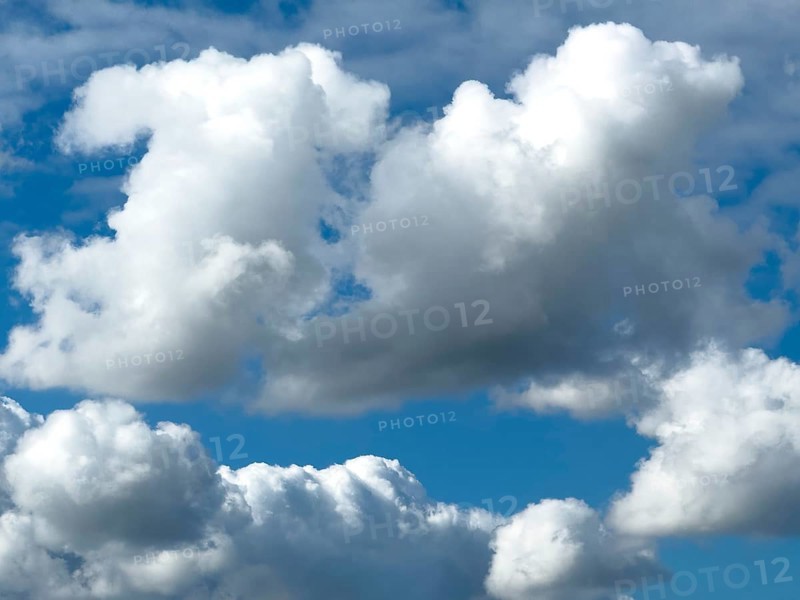 Below white clouds cumulus heap clouds above towering cumulonimbus, international