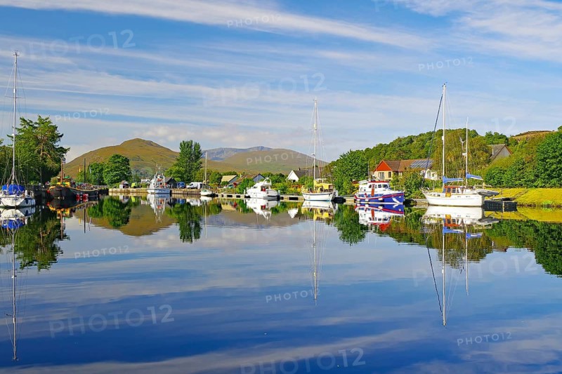 Calm river landscape with anchored boats and clear reflections, Caledonian Canal, Fort William, Highlands, Highlands, Scotland, Great Britain